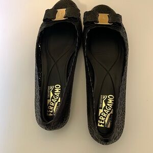 Ferragamo black flats. Only wore a few times.